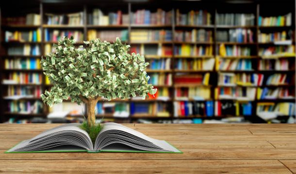 An open book with a tree growing from its pages, set against a library backdrop.