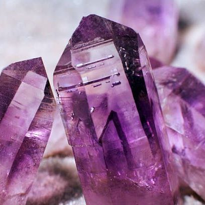 Ethically sourced crystals Close-up of amethyst crystals displaying deep purple hues and natural facets.
